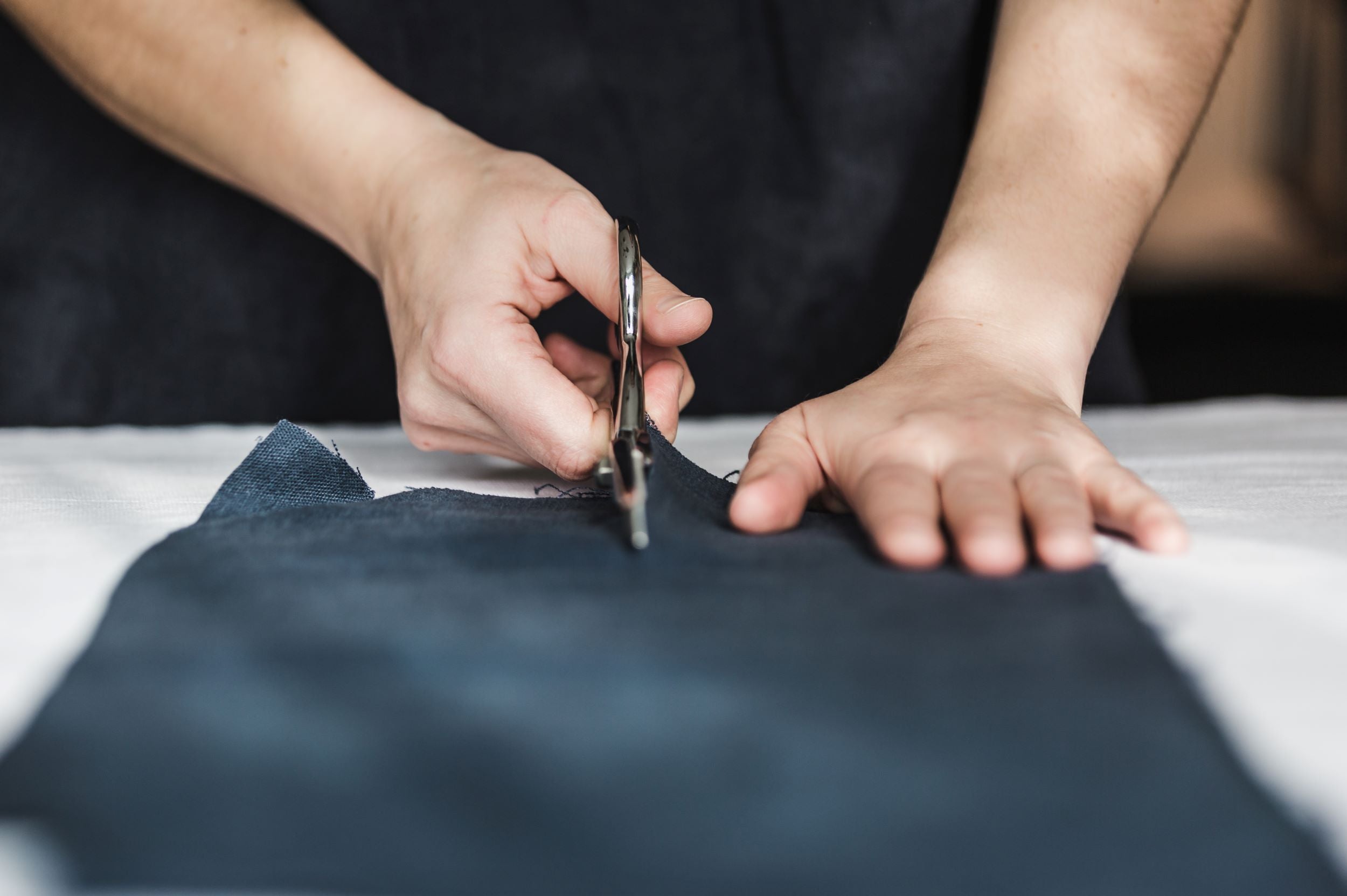 Scissors cutting fabric